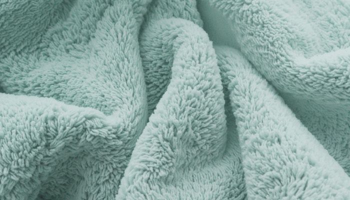 how to get rid of lint on new towels