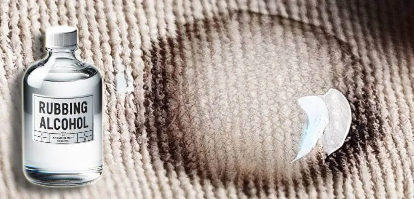 Applying rubbing alcohol to fabric glue residue
