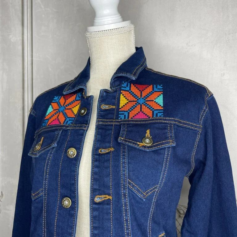 Cross stitch embroidery on denim jacket