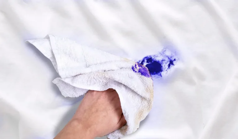 Ink stain on white fabric being treated