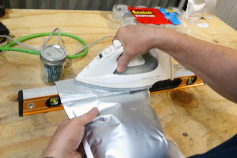 Sealing a mylar bag with a household clothes iron on a flat surface
